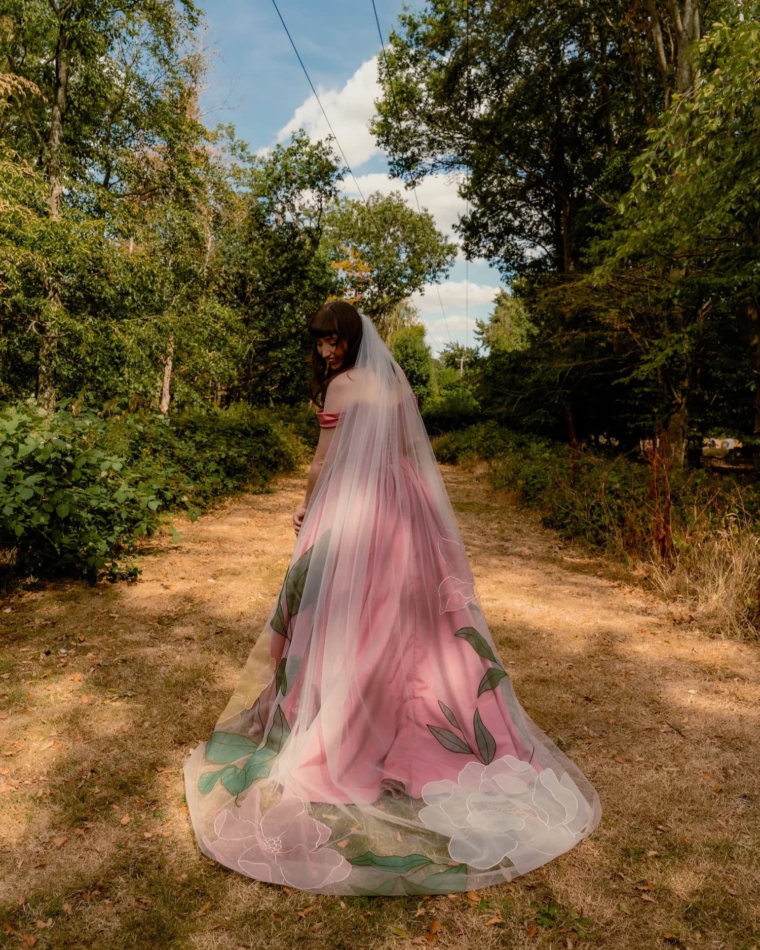 Lottie Fox Jones wearing the Tara Bridal Colorful Kaitie veil